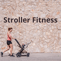 Women in shorts and tank top walking her baby in a stroller